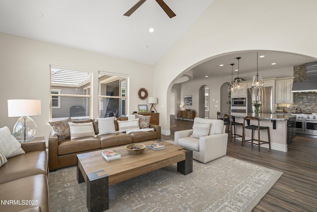 5427 Salmon River Ct, Reno, NV 89511 - living room with ceiling fan, arched walkways, dark wood-style floors, recessed lighting, and high vaulted ceiling
