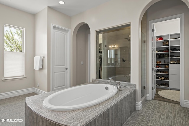 5427 Salmon River Ct, Reno, NV 89511 - bathroom with a stall shower, a bath, and a walk in closet