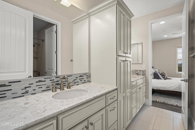 5427 Salmon River Ct, Reno, NV 89511 - bathroom with vanity, ensuite bath, backsplash, recessed lighting, and a shower