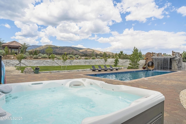 5427 Salmon River Ct, Reno, NV 89511 - view of swimming pool with a hot tub, a gazebo, a mountain view, and a patio