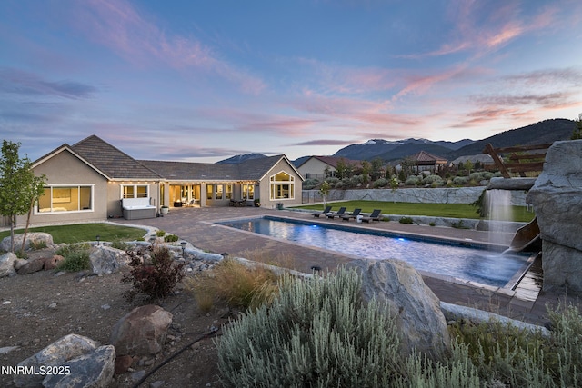 5427 Salmon River Ct, Reno, NV 89511 - outdoor pool featuring a patio area, a lawn, and a mountain view
