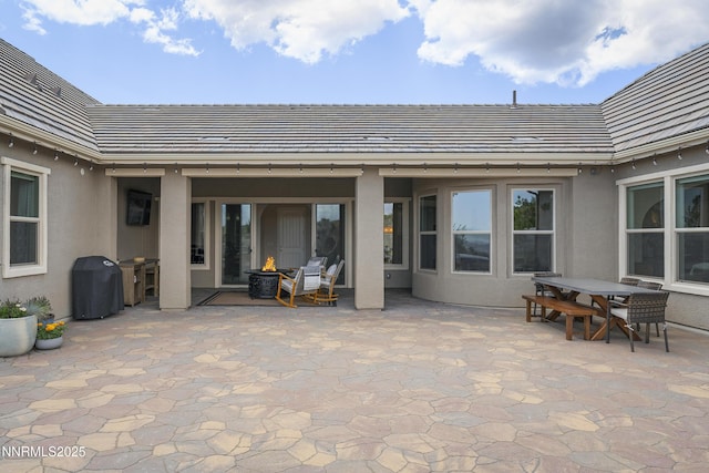 5427 Salmon River Ct, Reno, NV 89511 - view of patio / terrace featuring a fire pit, a grill, and outdoor dining space