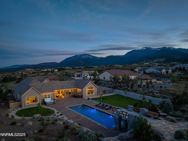 5427 Salmon River Ct, Reno, NV 89511 - outdoor pool with a mountain view, a gazebo, a fenced backyard, and a patio