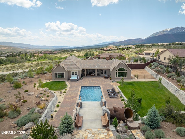 5427 Salmon River Ct, Reno, NV 89511 - view of swimming pool featuring a mountain view, a fenced backyard, and a patio