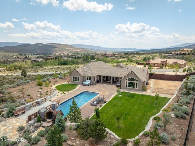 5427 Salmon River Ct, Reno, NV 89511 - view of pool with a fenced backyard, a mountain view, and a patio area