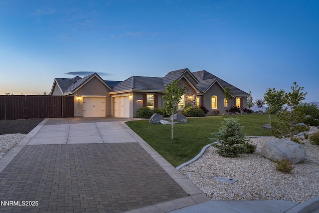 5427 Salmon River Ct, Reno, NV 89511 - ranch-style home featuring a garage, stucco siding, concrete driveway, and a tile roof