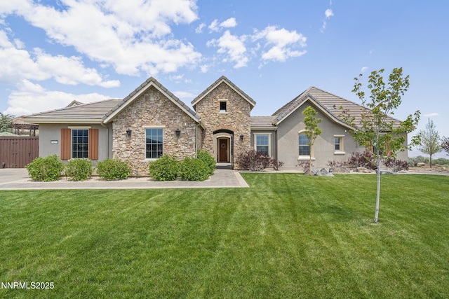 5427 Salmon River Ct, Reno, NV 89511 - view of front of home featuring stone siding, a tile roof, and stucco siding
