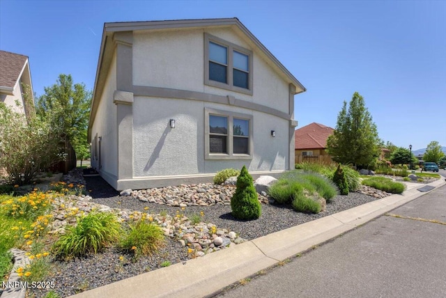1636 Robb Dr, Carson City, NV 89703 - view of side of home featuring stucco siding