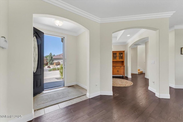 1636 Robb Dr, Carson City, NV 89703 - foyer featuring wood finished floors, ornamental molding, stairway, and arched walkways