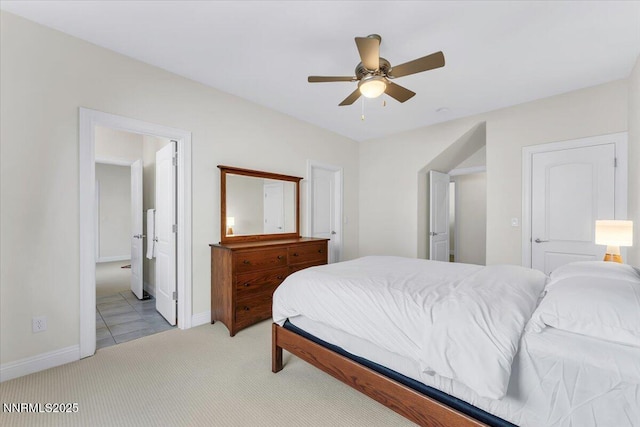 1636 Robb Dr, Carson City, NV 89703 - bedroom with light carpet, ensuite bathroom, and ceiling fan