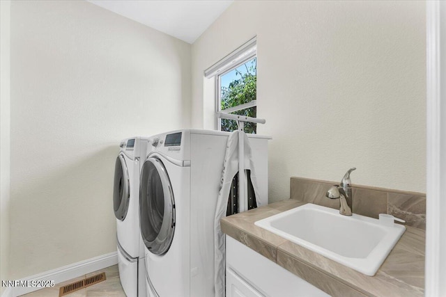 1636 Robb Dr, Carson City, NV 89703 - laundry area featuring washer and clothes dryer and cabinet space