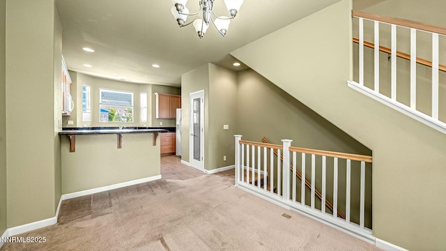225 Gramercy Ln, Reno, NV 89509 - hall with light carpet, recessed lighting, a chandelier, and an upstairs landing