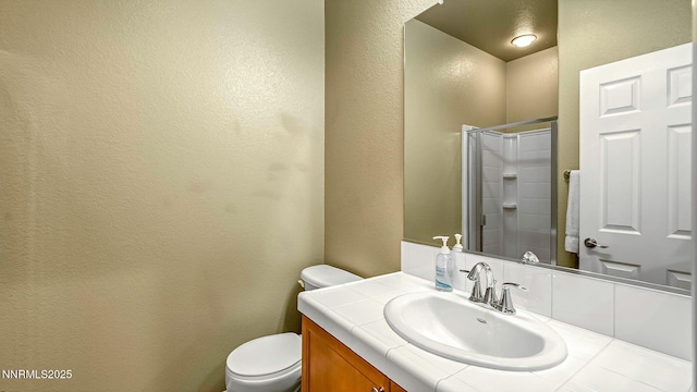 225 Gramercy Ln, Reno, NV 89509 - full bath with a textured wall, vanity, and a shower with shower door