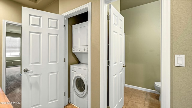 225 Gramercy Ln, Reno, NV 89509 - washroom featuring stacked washer and clothes dryer and light tile patterned floors