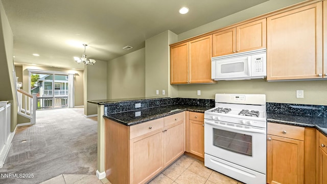 225 Gramercy Ln, Reno, NV 89509 - kitchen with white appliances, a peninsula, a chandelier, light colored carpet, and light brown cabinetry