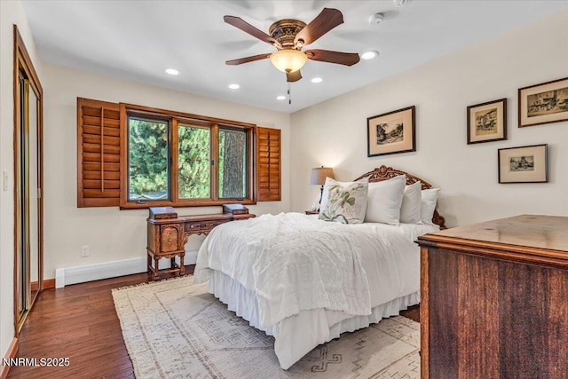 1263 Hidden Woods Dr, Zephyr Cove, NV 89413 - bedroom with wood finished floors, recessed lighting, baseboard heating, and a ceiling fan