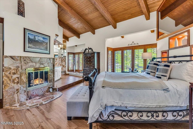 1263 Hidden Woods Dr, Zephyr Cove, NV 89413 - bedroom featuring wood finished floors, a wood ceiling with exposed beams, a fireplace, and high vaulted ceiling