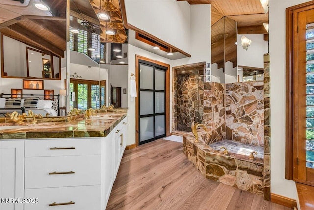 1263 Hidden Woods Dr, Zephyr Cove, NV 89413 - kitchen with wood ceiling, white cabinetry, light wood-style floors, high vaulted ceiling, and dark countertops
