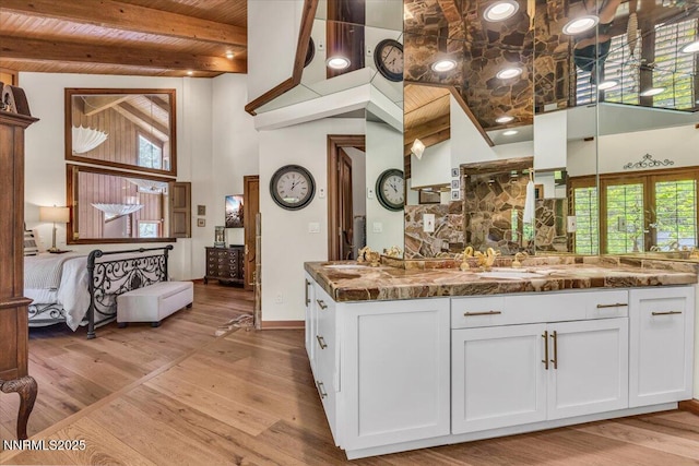 1263 Hidden Woods Dr, Zephyr Cove, NV 89413 - kitchen featuring a high ceiling, white cabinetry, light wood finished floors, and a wood ceiling with exposed beams