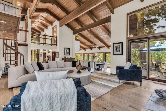1263 Hidden Woods Dr, Zephyr Cove, NV 89413 - living room with a wooden ceiling with exposed beams, high vaulted ceiling, stairway, wood finished floors, and ceiling fan