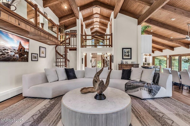 1263 Hidden Woods Dr, Zephyr Cove, NV 89413 - living area with a wooden ceiling with exposed beams, wood finished floors, stairs, high vaulted ceiling, and a ceiling fan
