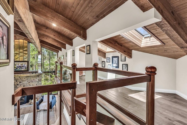 1263 Hidden Woods Dr, Zephyr Cove, NV 89413 - hall featuring wooden ceiling, a skylight, wood finished floors, and an upstairs landing