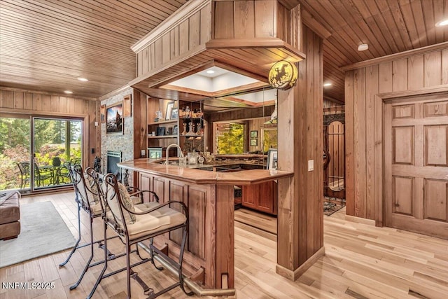 1263 Hidden Woods Dr, Zephyr Cove, NV 89413 - bar with wooden walls, wood ceiling, a stone fireplace, light wood-type flooring, and recessed lighting
