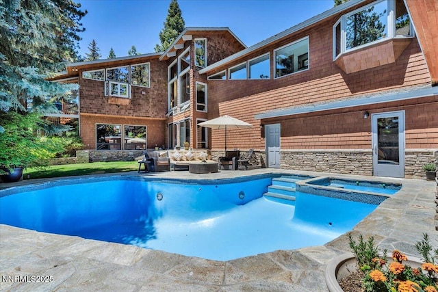 1263 Hidden Woods Dr, Zephyr Cove, NV 89413 - view of swimming pool featuring an outdoor hangout area, a patio area, and a pool with connected hot tub