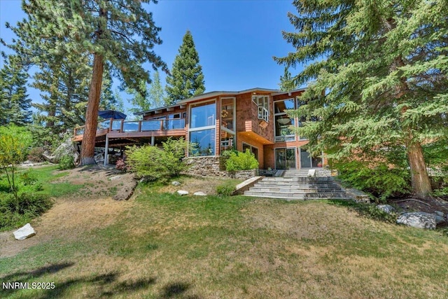 1263 Hidden Woods Dr, Zephyr Cove, NV 89413 - rear view of house featuring a yard and a deck