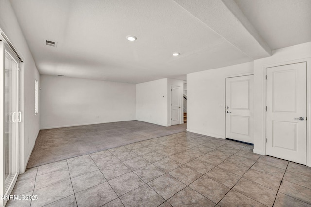 8977 Sagemoor Dr, Reno, NV 89506 - spare room featuring light carpet, recessed lighting, and light tile patterned flooring