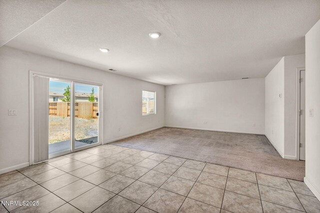 8977 Sagemoor Dr, Reno, NV 89506 - spare room with light colored carpet, a textured ceiling, and recessed lighting