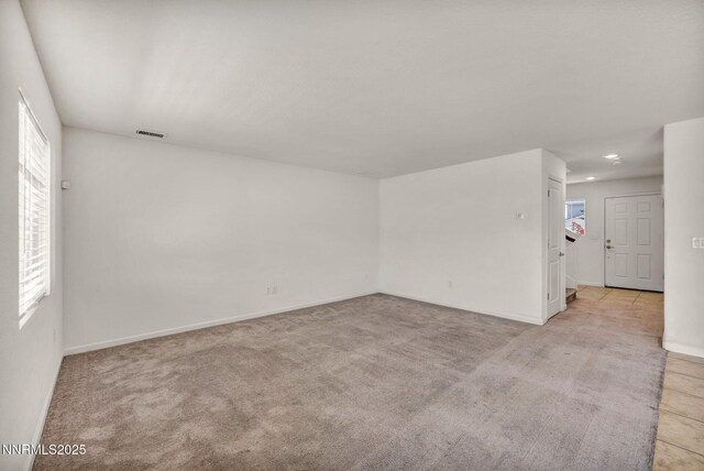 8977 Sagemoor Dr, Reno, NV 89506 - empty room with light carpet and recessed lighting