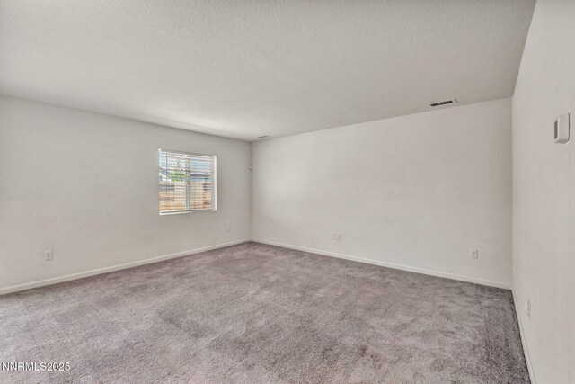 8977 Sagemoor Dr, Reno, NV 89506 - empty room with a textured ceiling and carpet