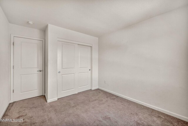 8977 Sagemoor Dr, Reno, NV 89506 - unfurnished bedroom with carpet flooring and a closet