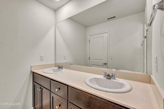 8977 Sagemoor Dr, Reno, NV 89506 - bathroom with double vanity and a textured wall
