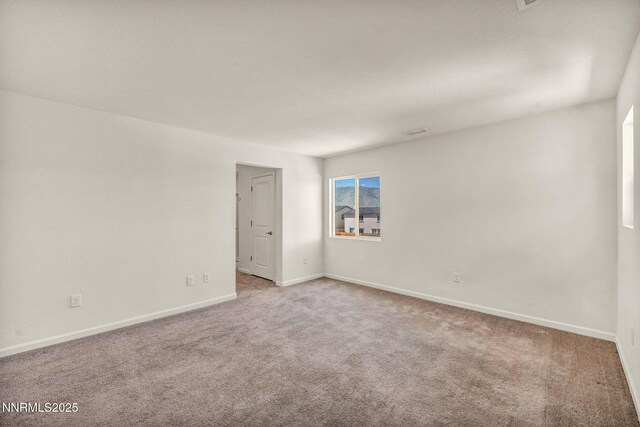 8977 Sagemoor Dr, Reno, NV 89506 - unfurnished room featuring light colored carpet