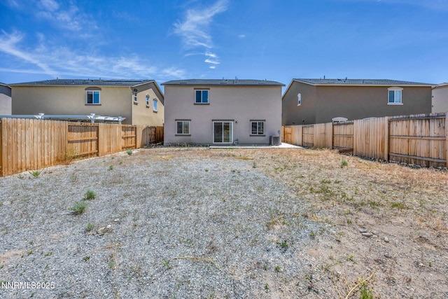 8977 Sagemoor Dr, Reno, NV 89506 - rear view of property with a fenced backyard and stucco siding