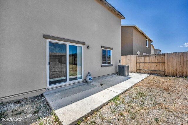 8977 Sagemoor Dr, Reno, NV 89506 - back of property featuring a patio area and stucco siding