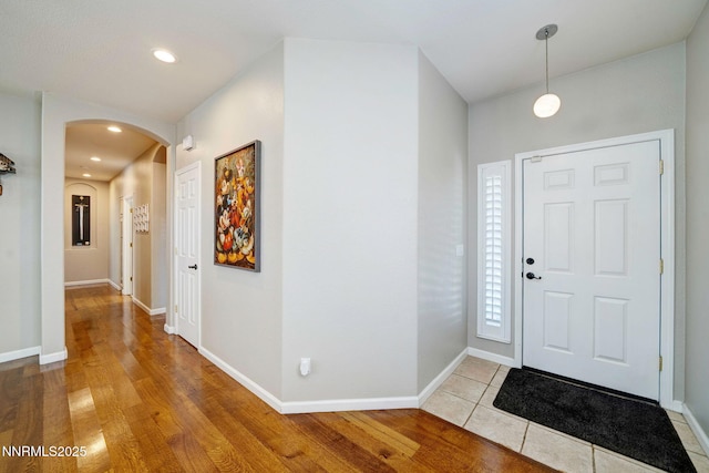 1575 Canyonlands Ct, Reno, NV 89521 - foyer entrance featuring arched walkways, light wood-style floors, and recessed lighting
