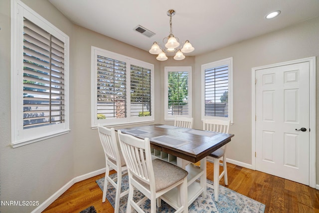 1575 Canyonlands Ct, Reno, NV 89521 - dining room with a chandelier, wood finished floors, and recessed lighting