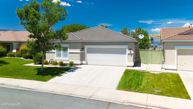 1575 Canyonlands Ct, Reno, NV 89521 - ranch-style home featuring a tile roof, stucco siding, a garage, and concrete driveway