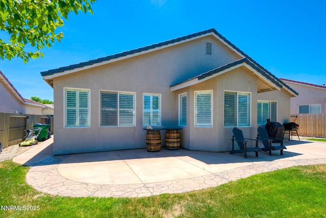 1575 Canyonlands Ct, Reno, NV 89521 - rear view of house featuring stucco siding and a patio area