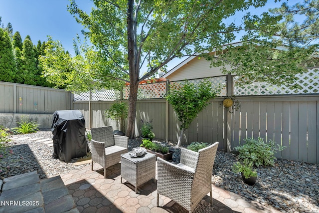 6161 Wycliffe Cir, Reno, NV 89519 - fenced backyard featuring a patio and a grill