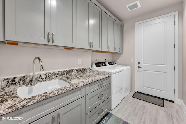 6161 Wycliffe Cir, Reno, NV 89519 - laundry area with cabinet space and independent washer and dryer