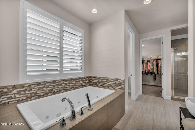 6161 Wycliffe Cir, Reno, NV 89519 - full bath with a jetted tub, a stall shower, a walk in closet, and recessed lighting