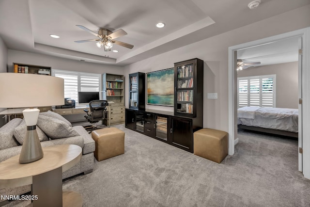 6161 Wycliffe Cir, Reno, NV 89519 - carpeted living area with a ceiling fan, a desk, a tray ceiling, and recessed lighting