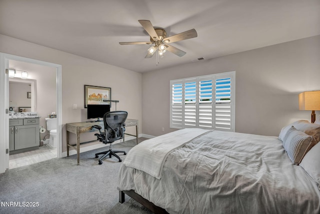 6161 Wycliffe Cir, Reno, NV 89519 - bedroom featuring light colored carpet, a desk, ensuite bathroom, and a ceiling fan
