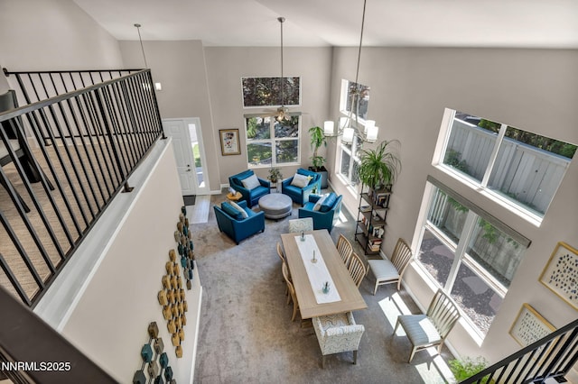 6161 Wycliffe Cir, Reno, NV 89519 - carpeted living area with high vaulted ceiling and baseboards