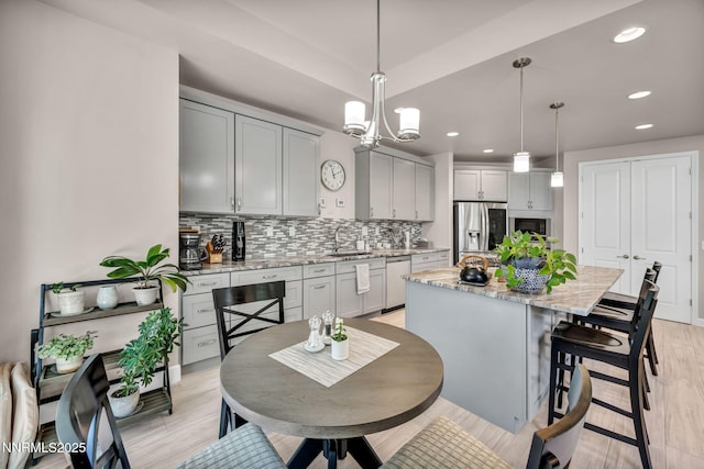 6161 Wycliffe Cir, Reno, NV 89519 - dining room featuring recessed lighting, a chandelier, and light wood-style flooring