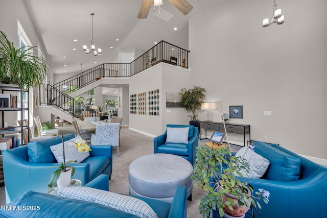 6161 Wycliffe Cir, Reno, NV 89519 - living room with stairs, a chandelier, carpet, a towering ceiling, and a ceiling fan